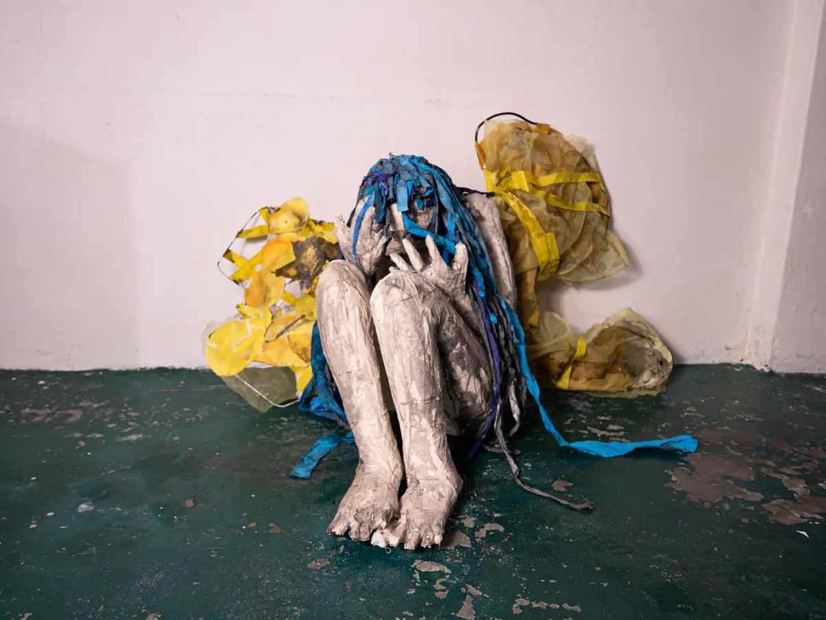 Na-bi crouching sculpture
